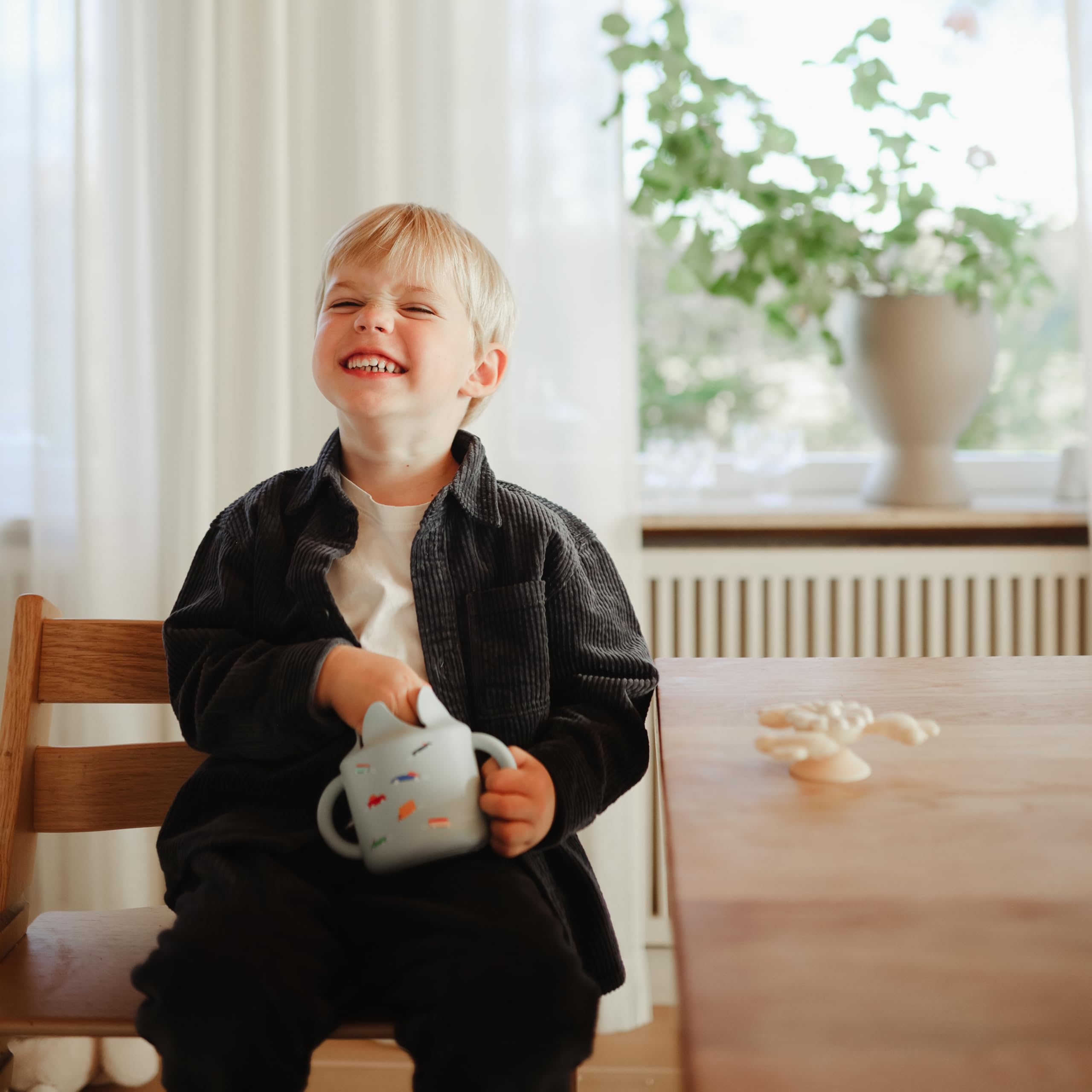 Mushie snack cup dishwasher-safe for easy cleaning.