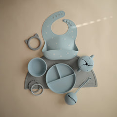 Mushie silicone snack cup powder blue no-slip bottom prevents sliding during meals