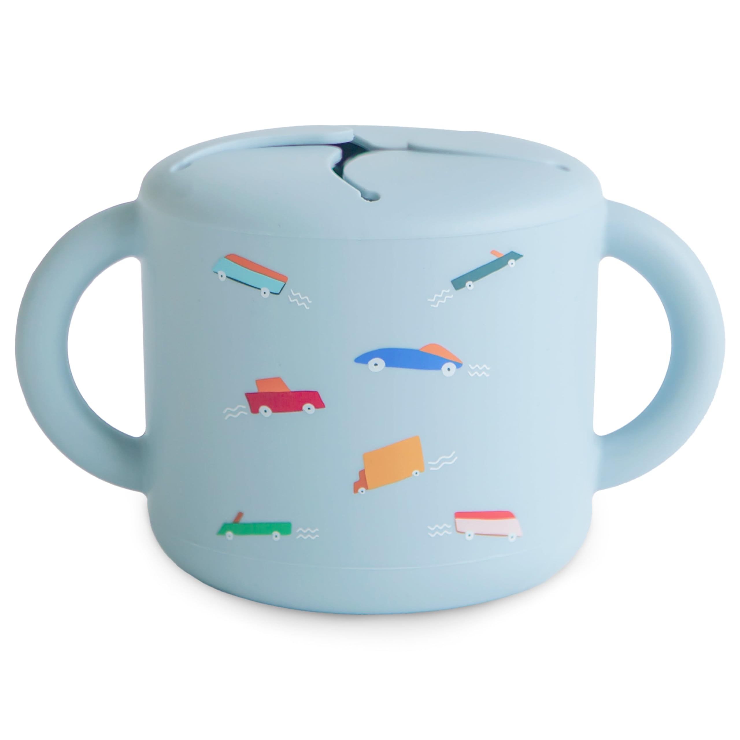 Mushie silicone snack cup on the go with a spill-proof design.