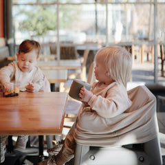Mushie silicone snack cup, self-feeding design for independent eating.