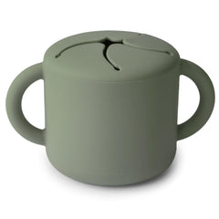 Mushie silicone snack cup top view with two handles for easy toddler gripping.