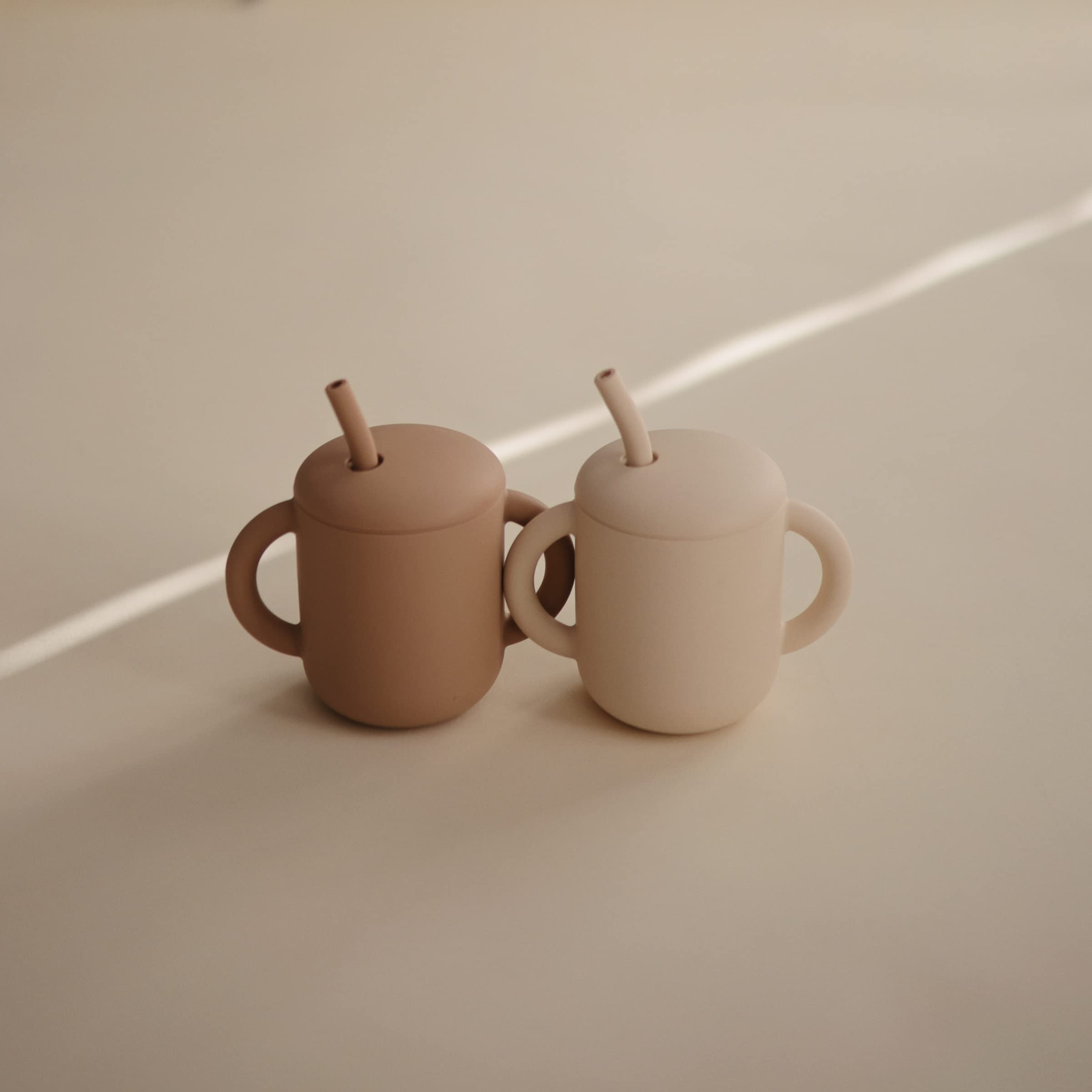 Mushie silicone straw close-up shows soft, baby-friendly sipping design.