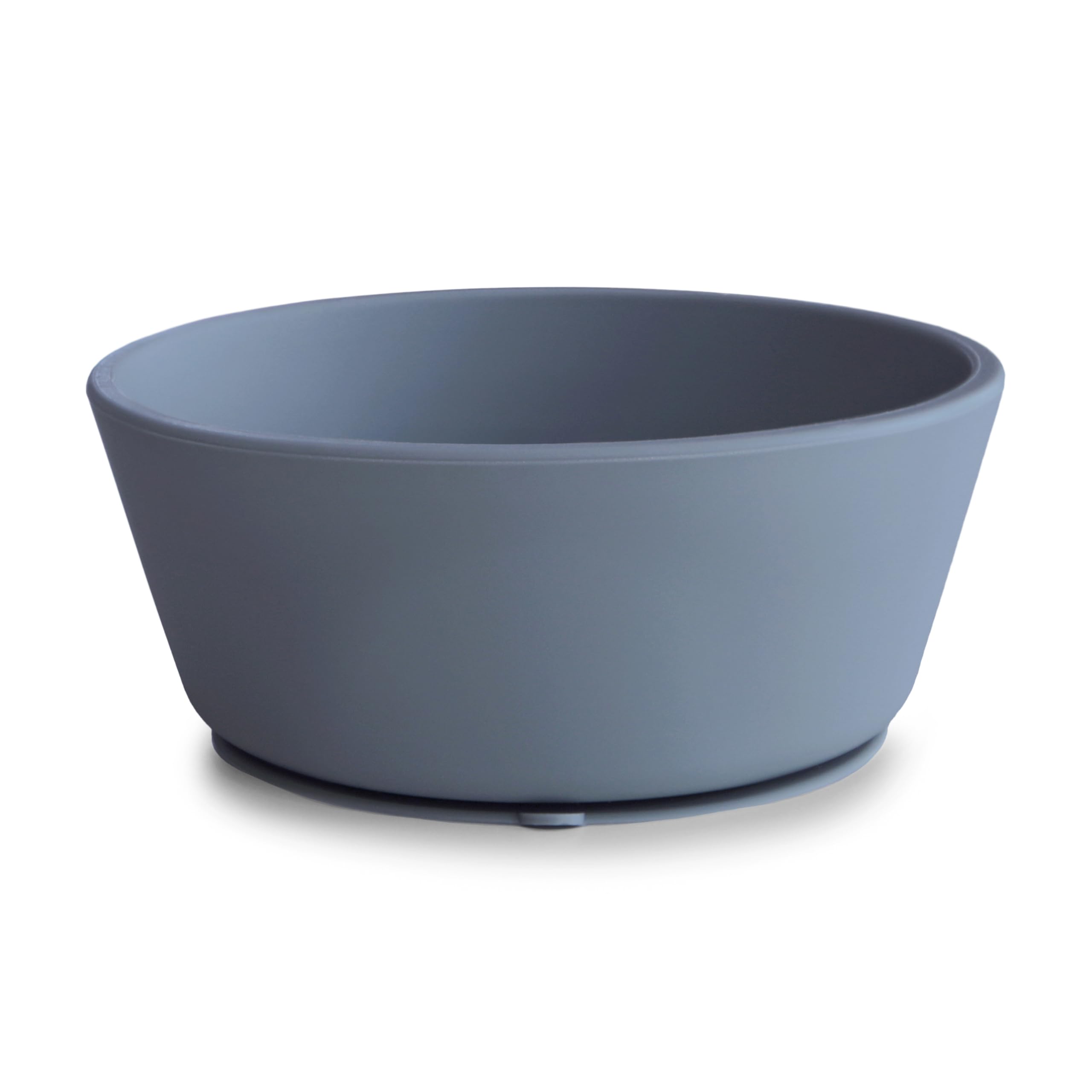 Mushie silicone suction bowl with anti-slip base prevents spills during self-feeding.