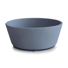 Mushie silicone suction bowl with anti-slip base prevents spills during self-feeding.