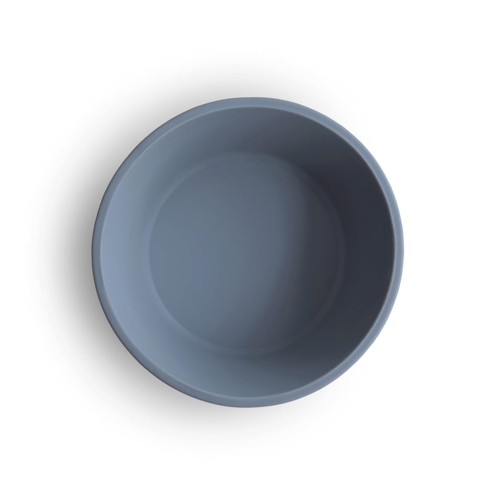 Mushie suction bowl in use for self-feeding, reducing mess at mealtime.