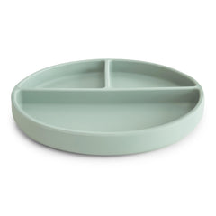 Mushie suction plate on table demonstrates anti-slip design for self-feeding beginners
