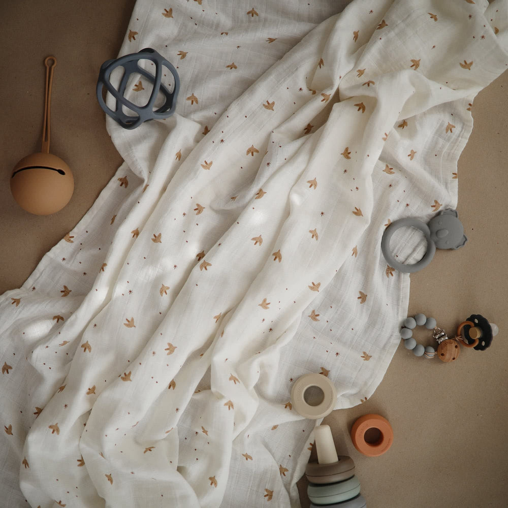 Mushie Sparrow muslin swaddle stays breathable while keeping baby warm and snug.