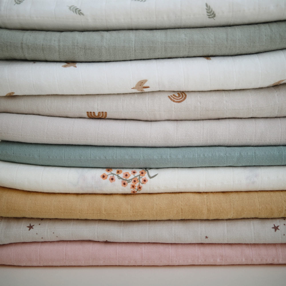 Mushie Sparrow muslin swaddle care: wash at 30C and lay flat to dry.