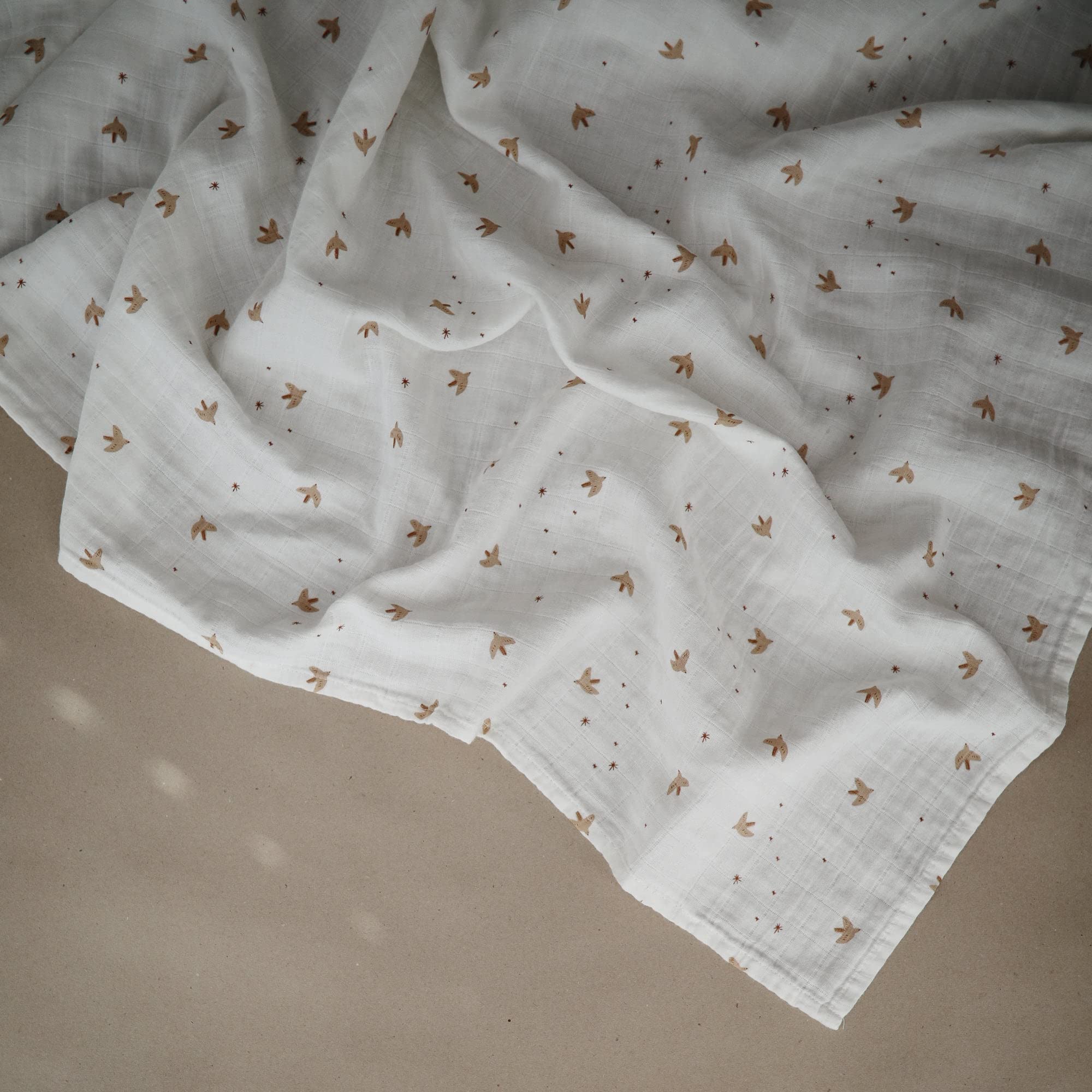 Mushie Sparrow muslin swaddle blanket is pre-washed for extra softness against delicate skin.