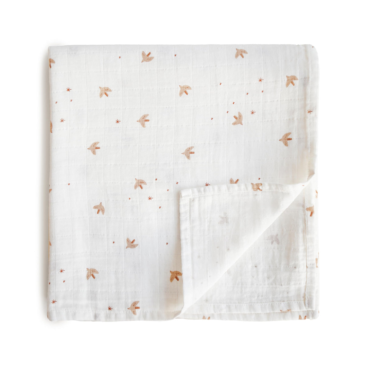 Mushie Sparrow muslin swaddle blanket with soft, breathable fabric for peaceful baby naps.