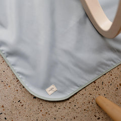 Mushie Splat Mat foldable design fits in a diaper bag