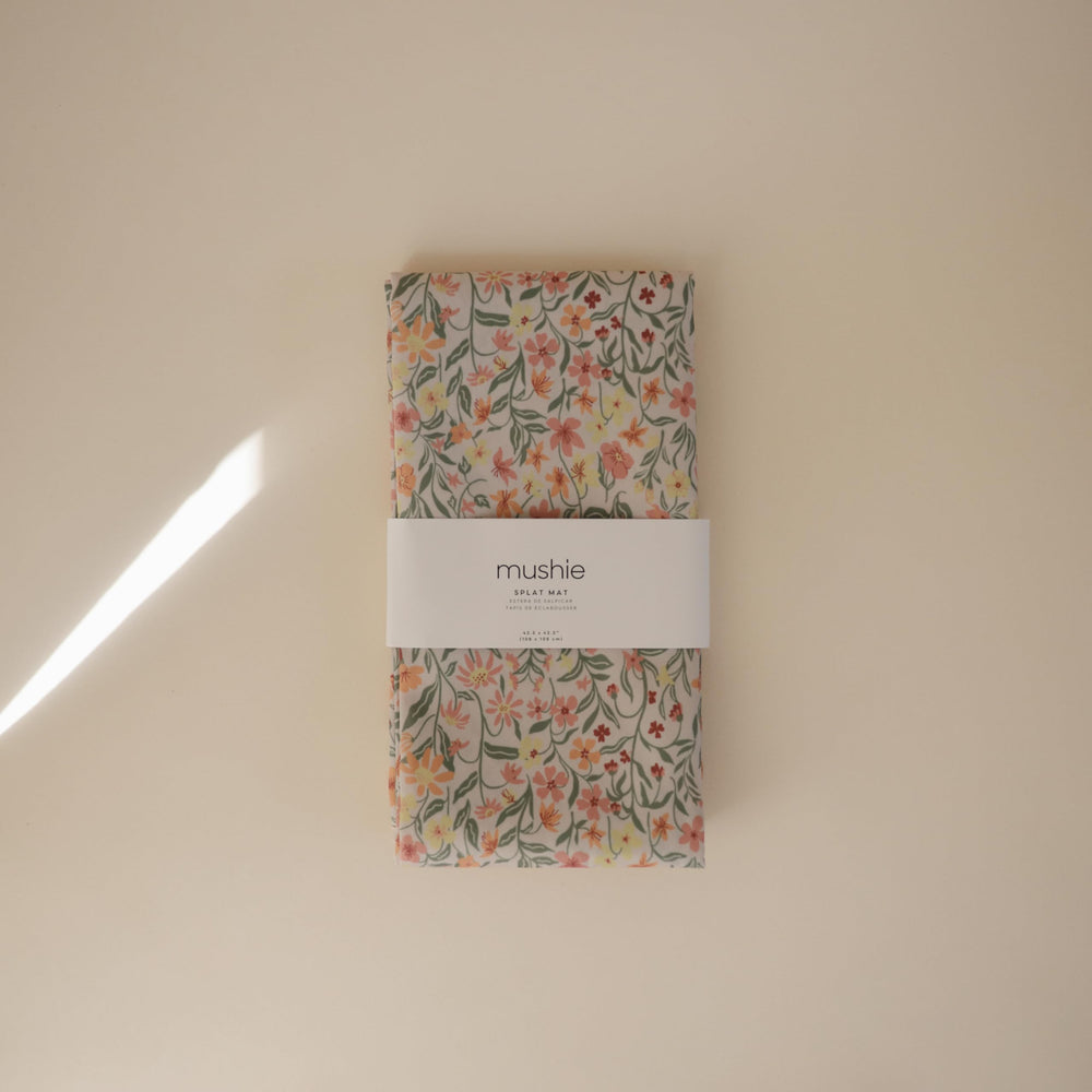 Mushie Splat Mat Pastel Blooms at playtime keeps crafts contained and tidy
