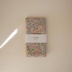 Mushie Splat Mat Pastel Blooms at playtime keeps crafts contained and tidy