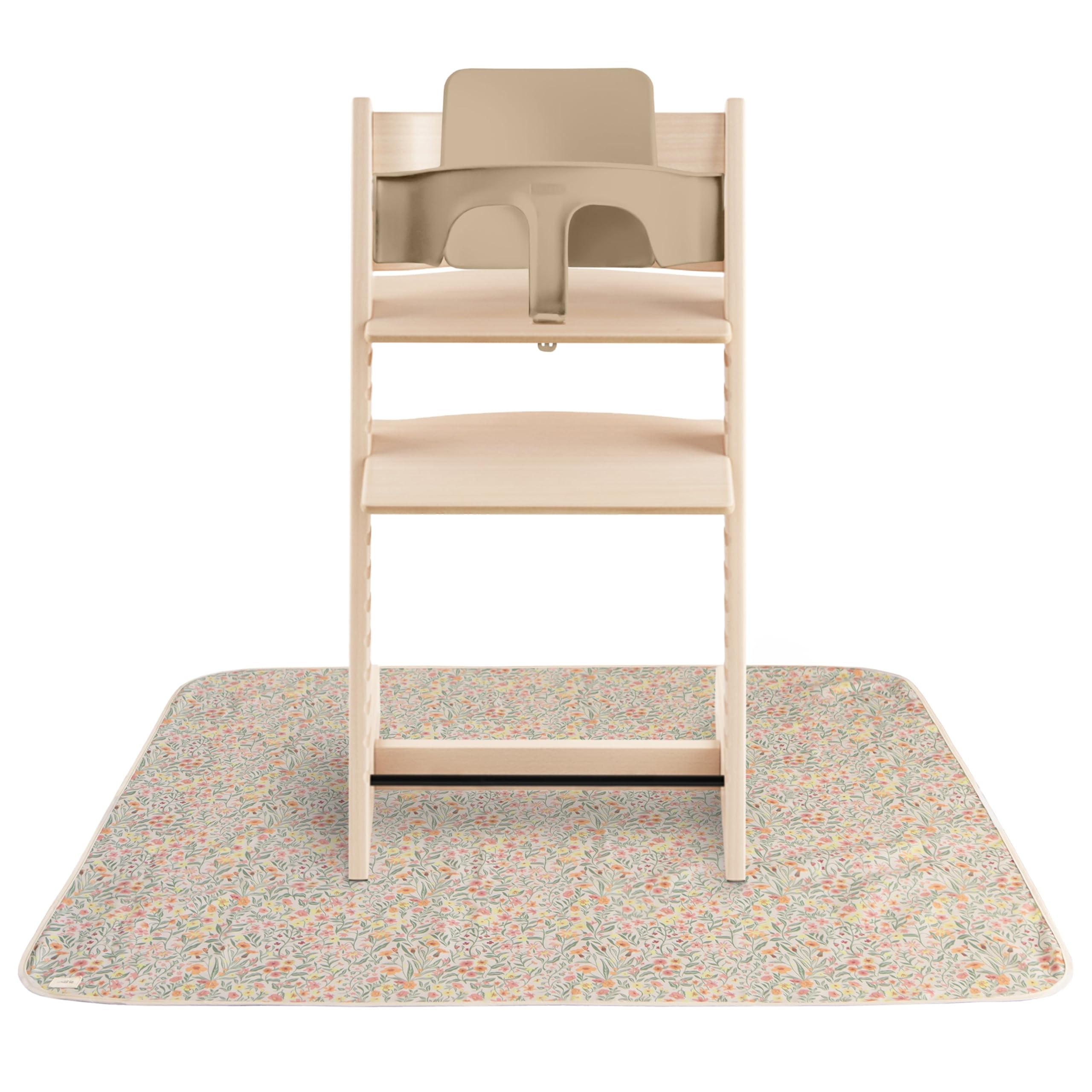 Mushie Splat Mat Pastel Blooms under high chair catching spills for easy cleanup