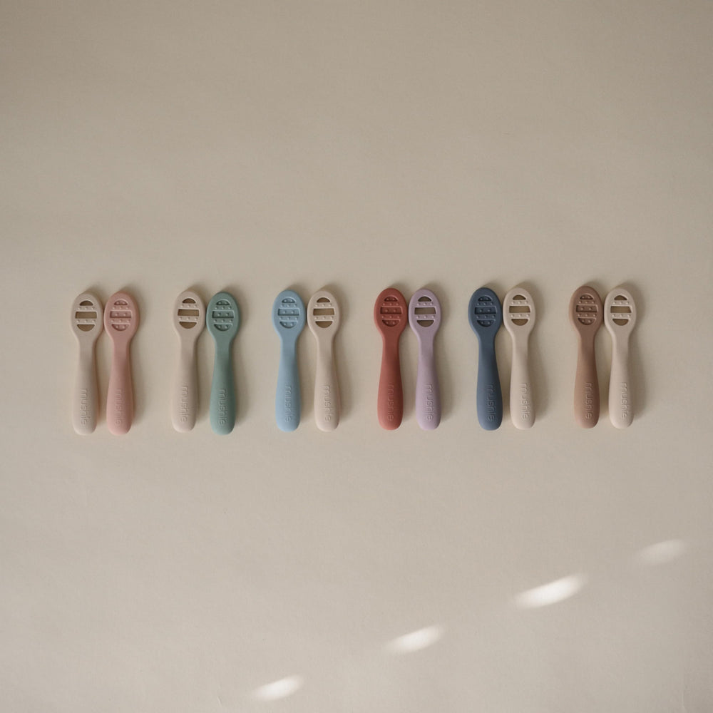 Mushie spoons feature sensory dots to soothe teething gums during meals.