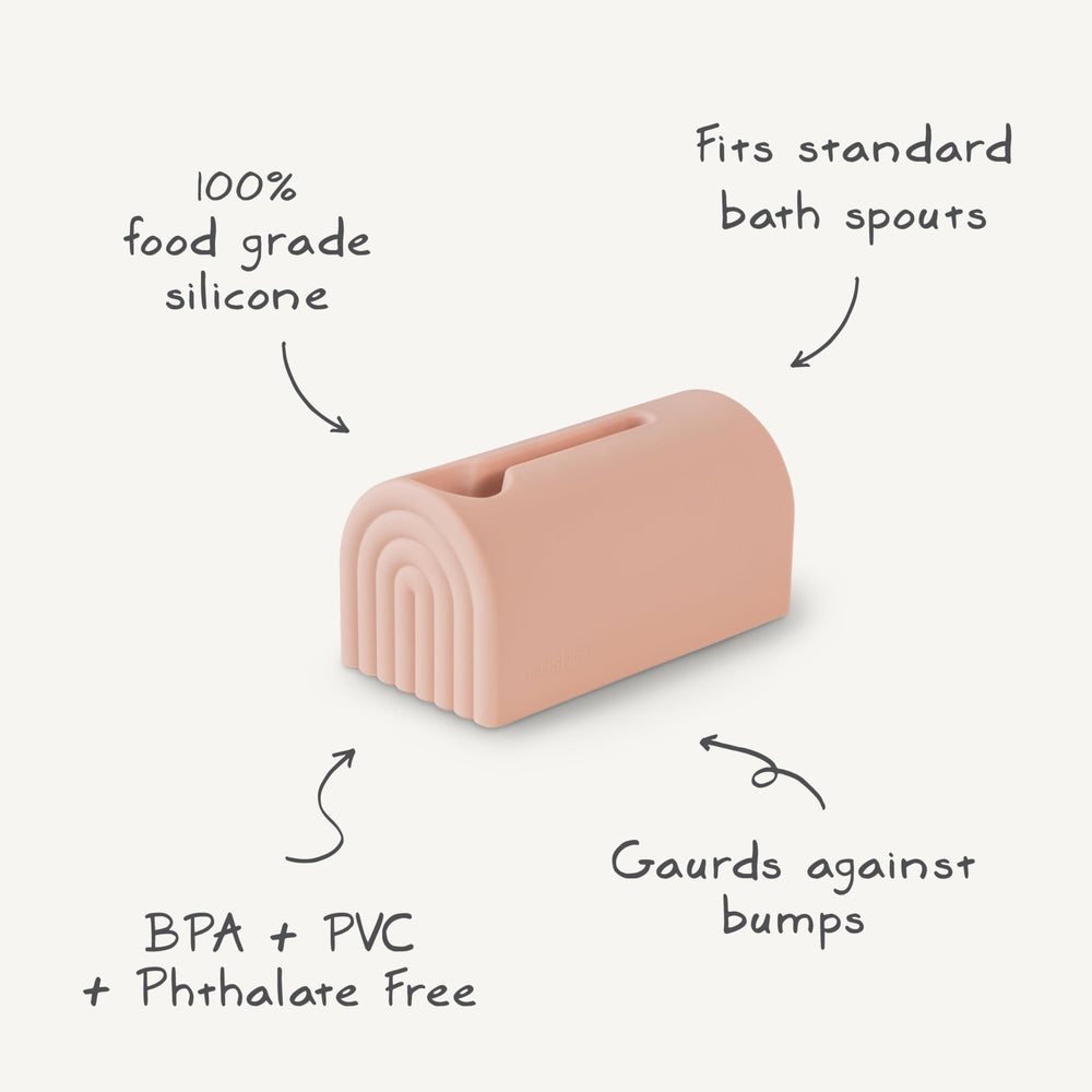 Mushie spout cover soft silicone surrounds exposed spout edges for gentle safety.