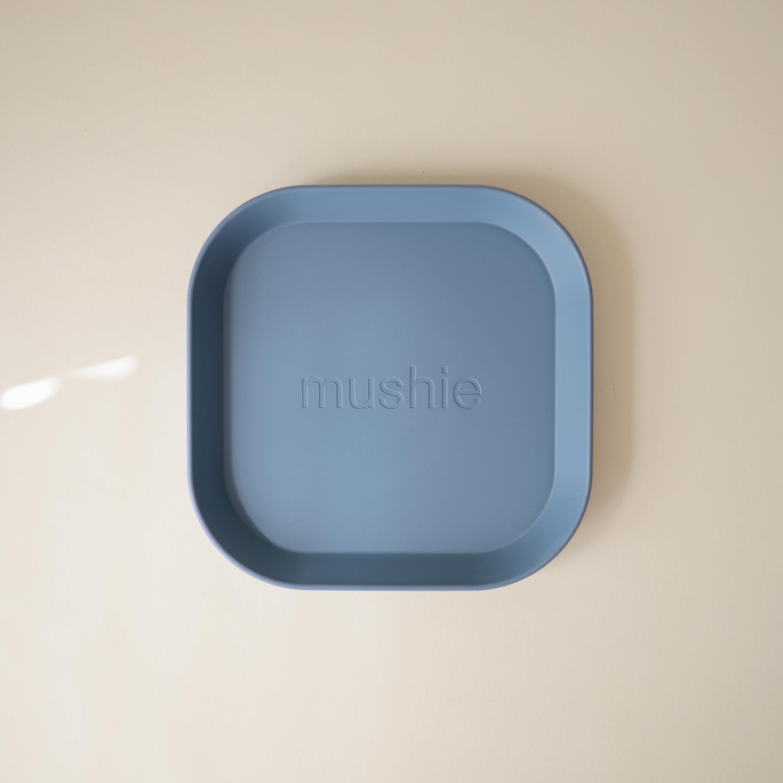 Mushie Twilight Blue plates stacked for compact storage and simple serving.