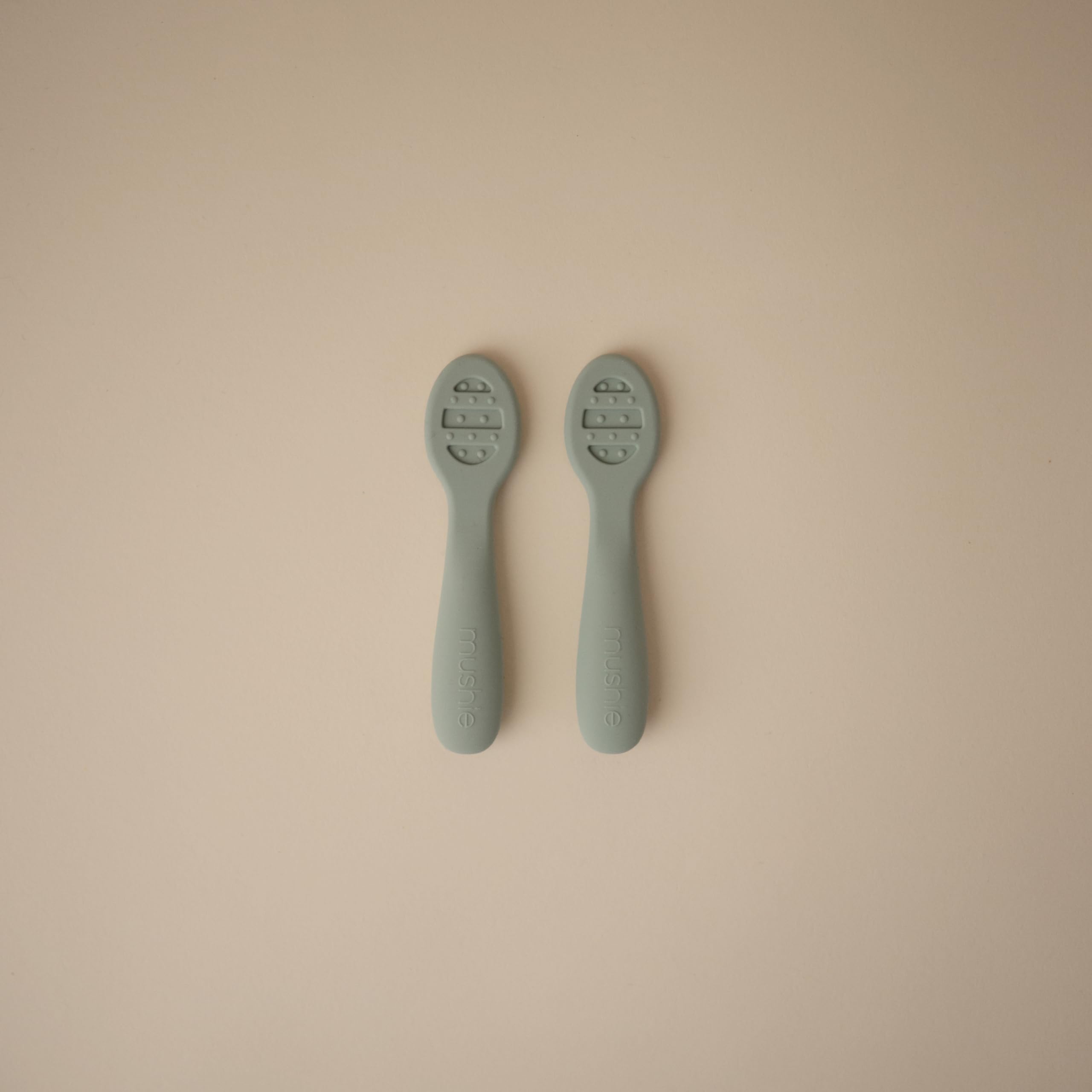 Stage 1 solid-surface Mushie spoon helps thin purees and yogurts easily.
