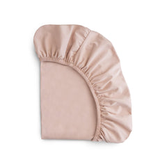 Mushie Stretchy Mini Crib Sheet blush closeup knit texture for gentle softness