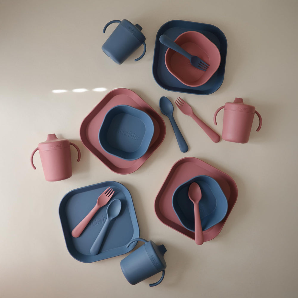 Mushie Twilight Blue flatware set on table with simple design