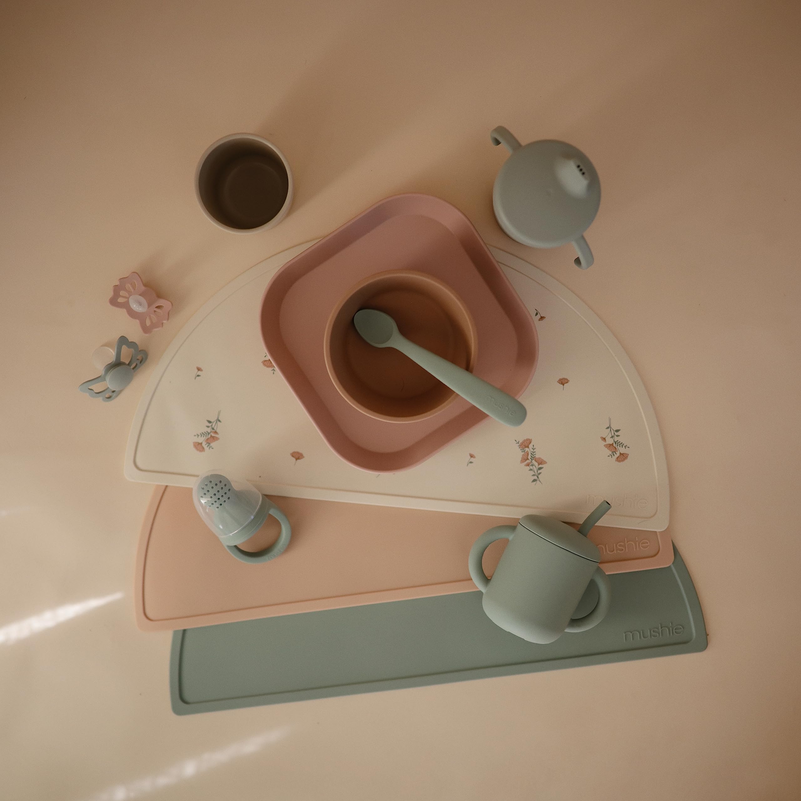 Mushie two-piece design shown for easy cleaning.