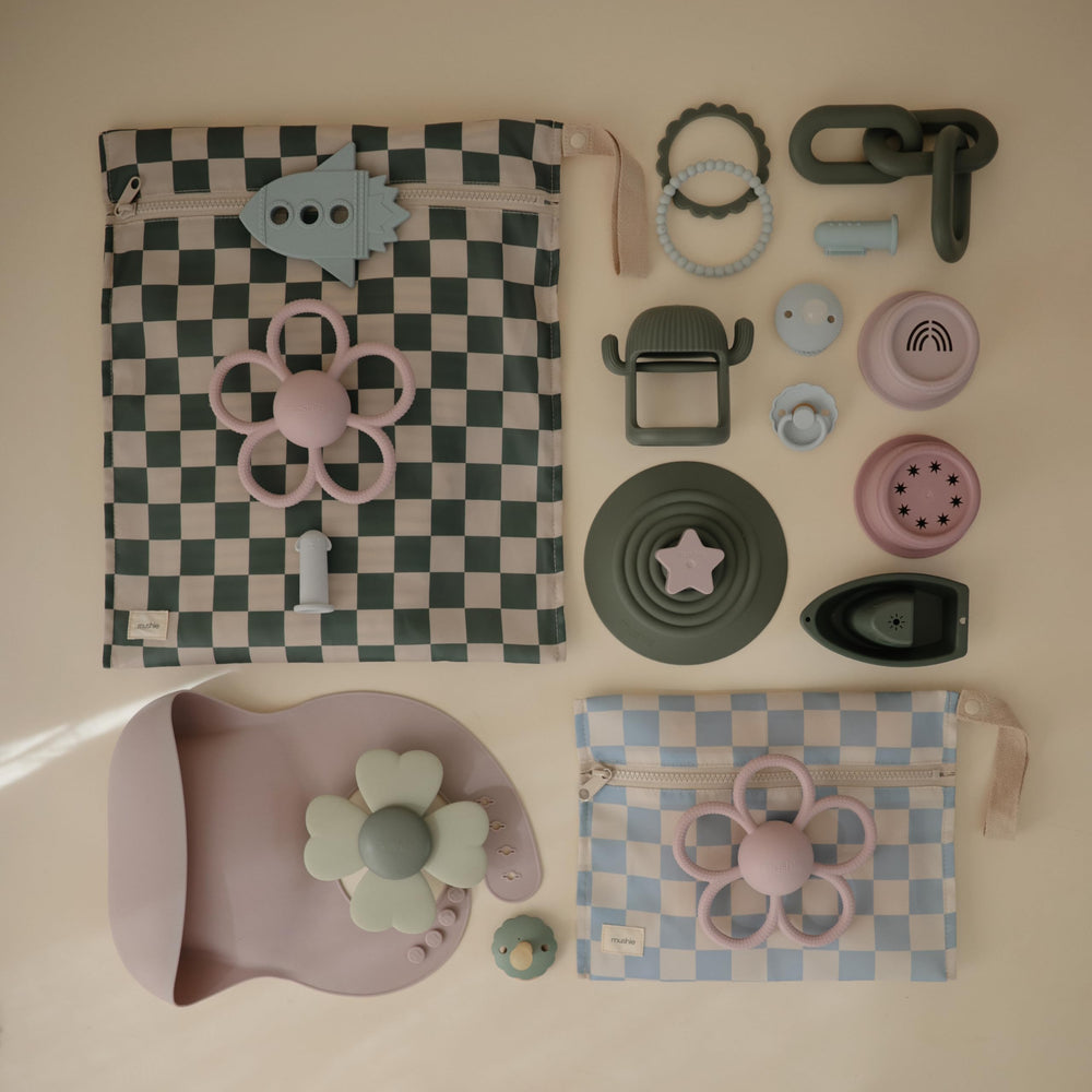 Mushie blue-check wet bag showing durable material for everyday use.