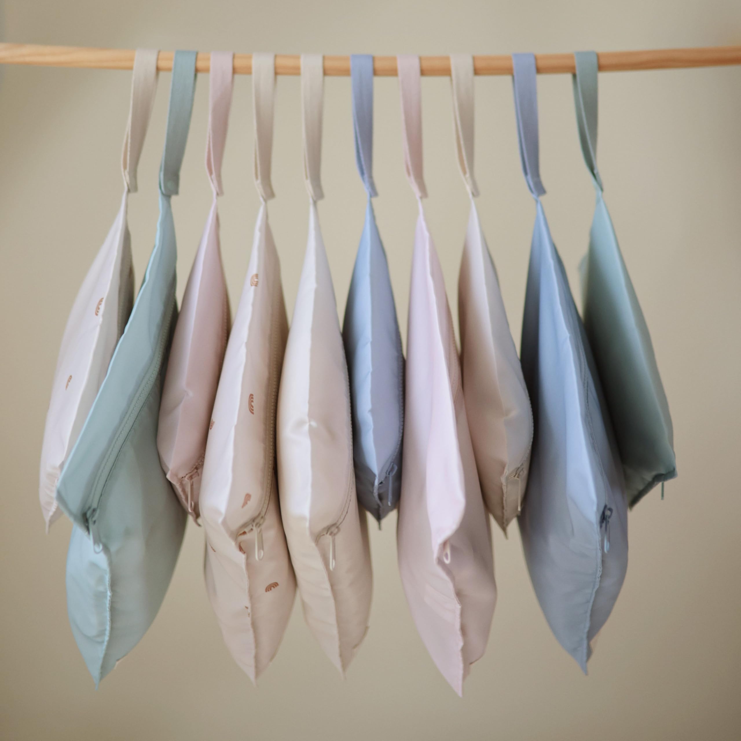 Mushie blue-check wet bag set offering versatile storage options.