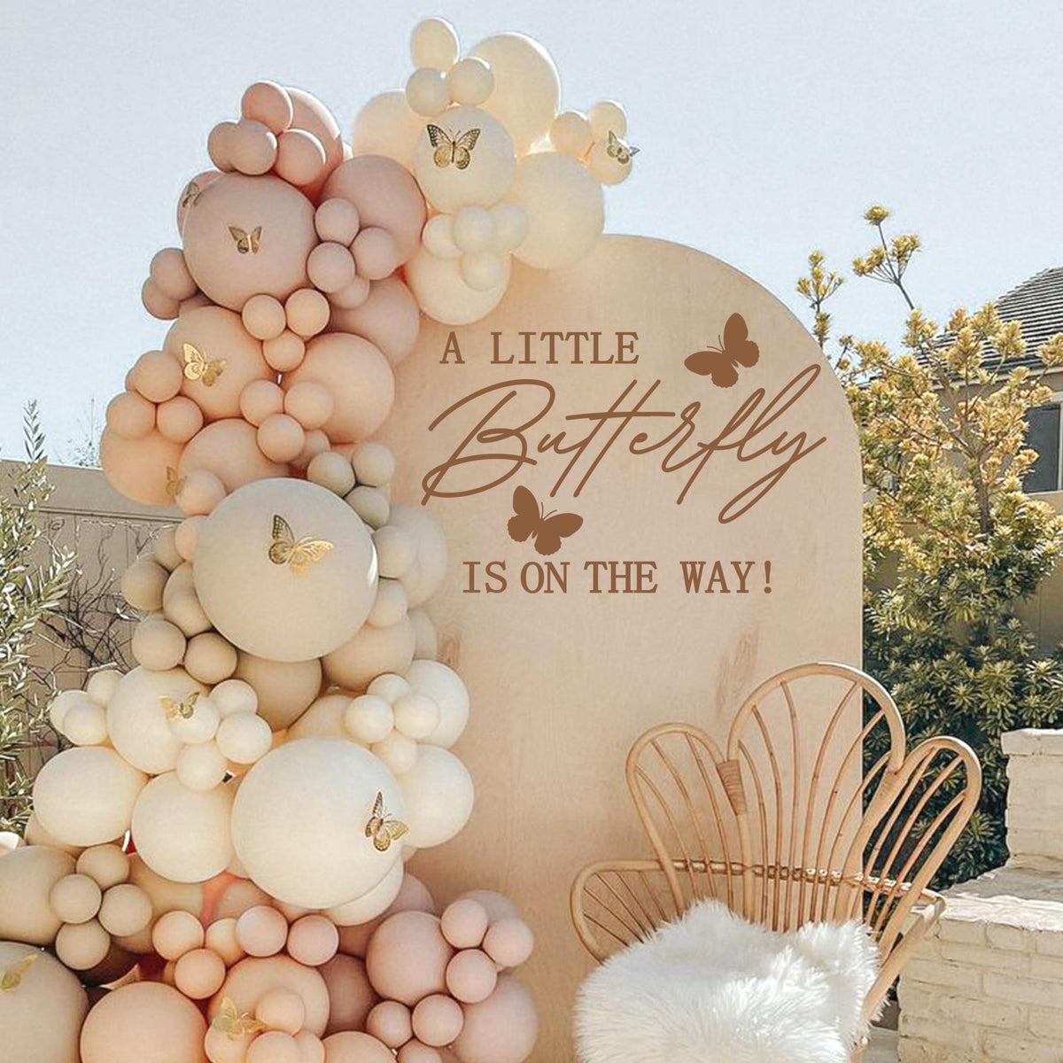 MUWEOL A Little Butterfly Is On The Way decal on wall adds charming baby shower ambience.