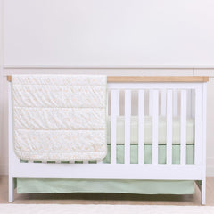 My Little Zone green crib skirt 52x28 on a standard crib hides storage space and adds woodland charm.