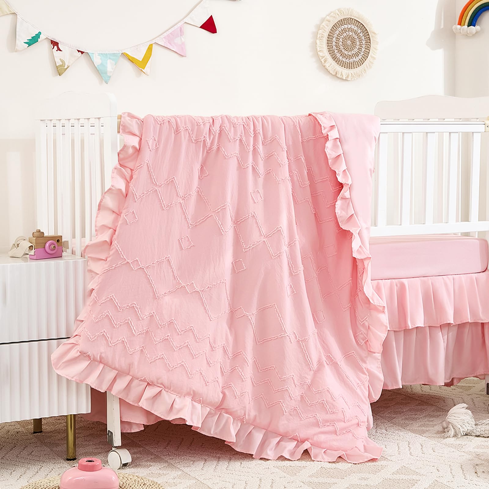 NacoMoco 3-piece tufted ruffle crib bedding in light pink adds boho charm to nurseries.