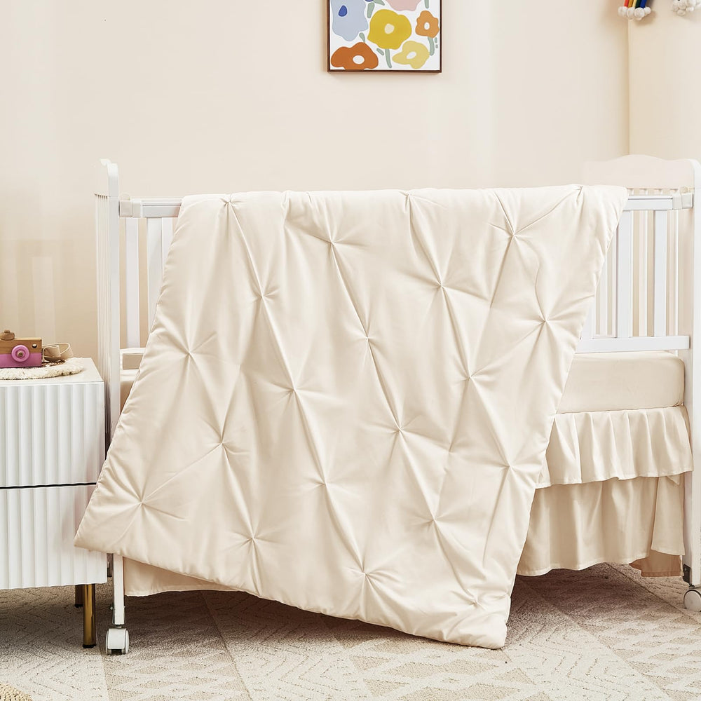 NacoMoco crib bedding fabric close-up reveals ultra-soft microfiber gentle on baby's skin.