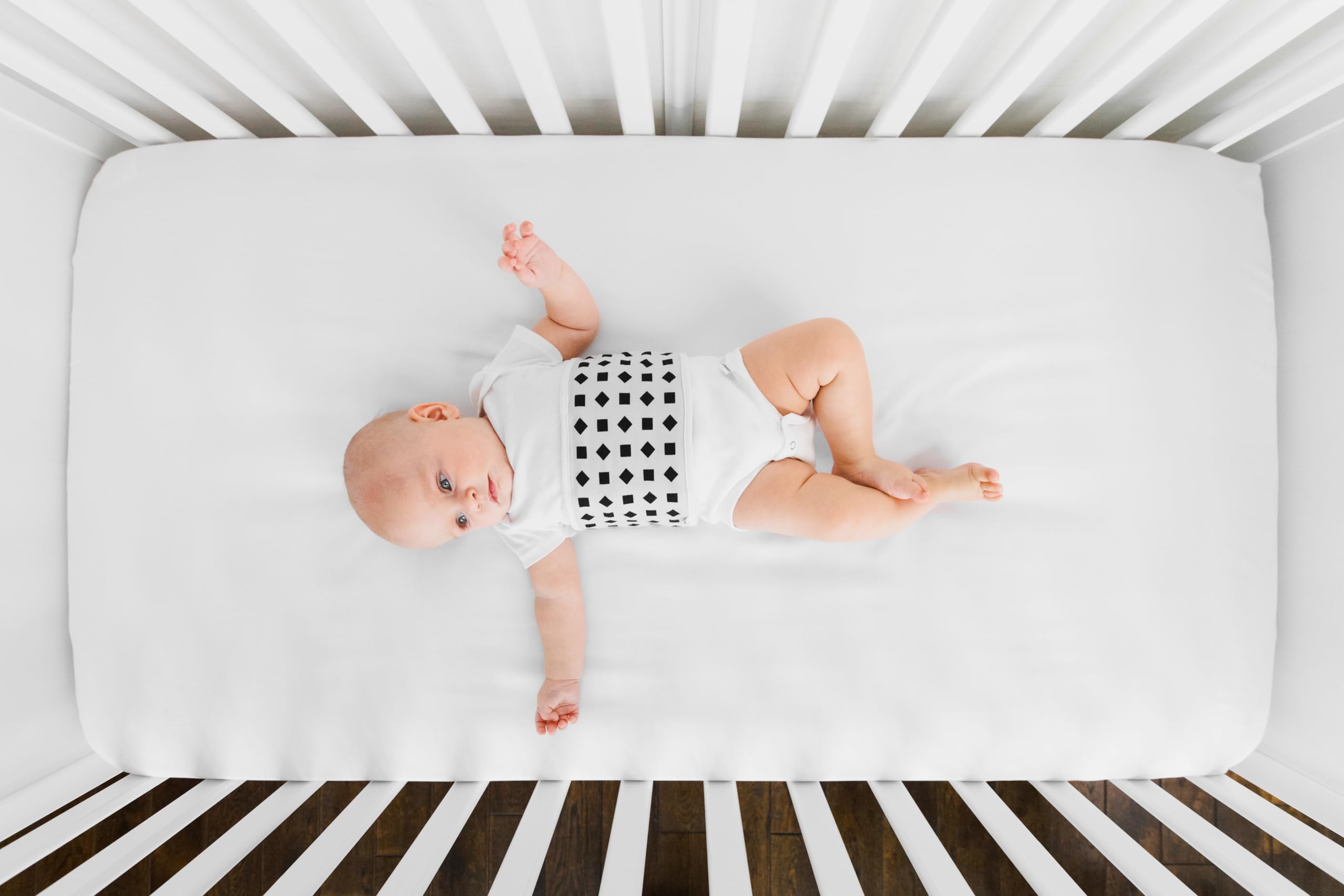 Nanit Breathing Wear Band on baby, ideal for real-night routine monitoring.