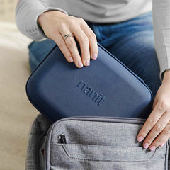 Nanit Travel Pack shown in a diaper bag setup for travel-ready protection.