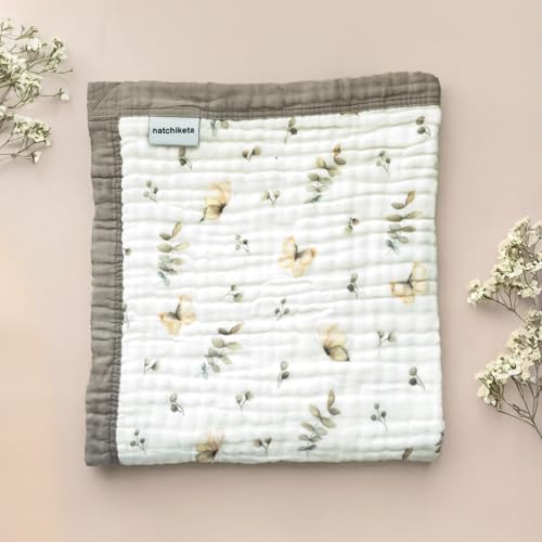 Natchiketa organic cotton muslin blanket stroller cover provides shade and comfort on outings