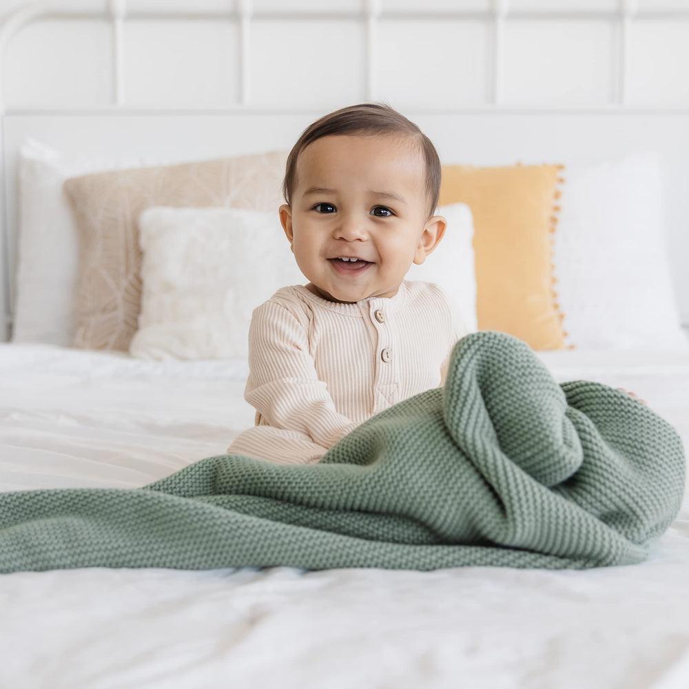 Natemia tummy-time mat substitute provides a soft, breathable surface.