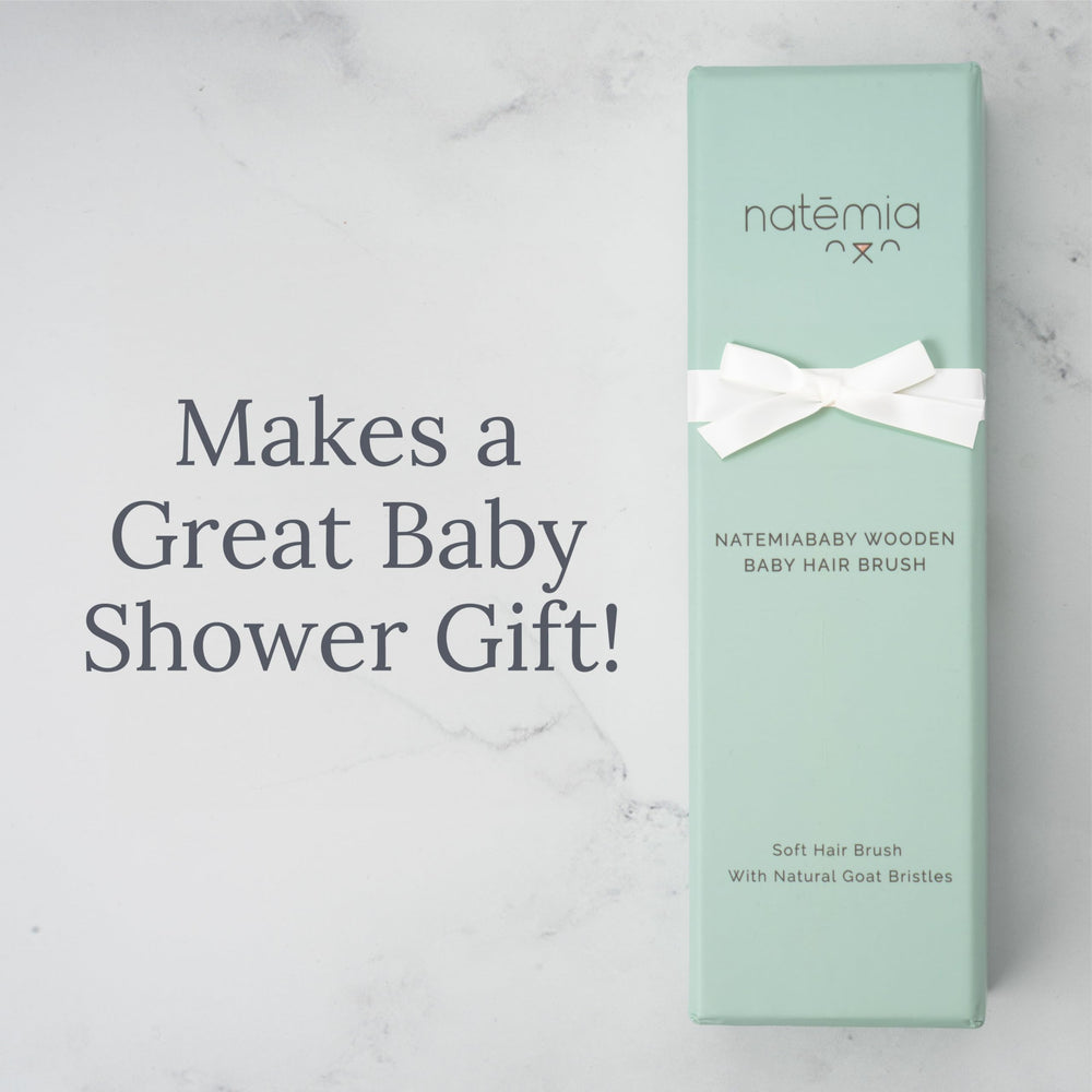 Natemia gift-ready baby brush, a thoughtful addition to a grooming kit.