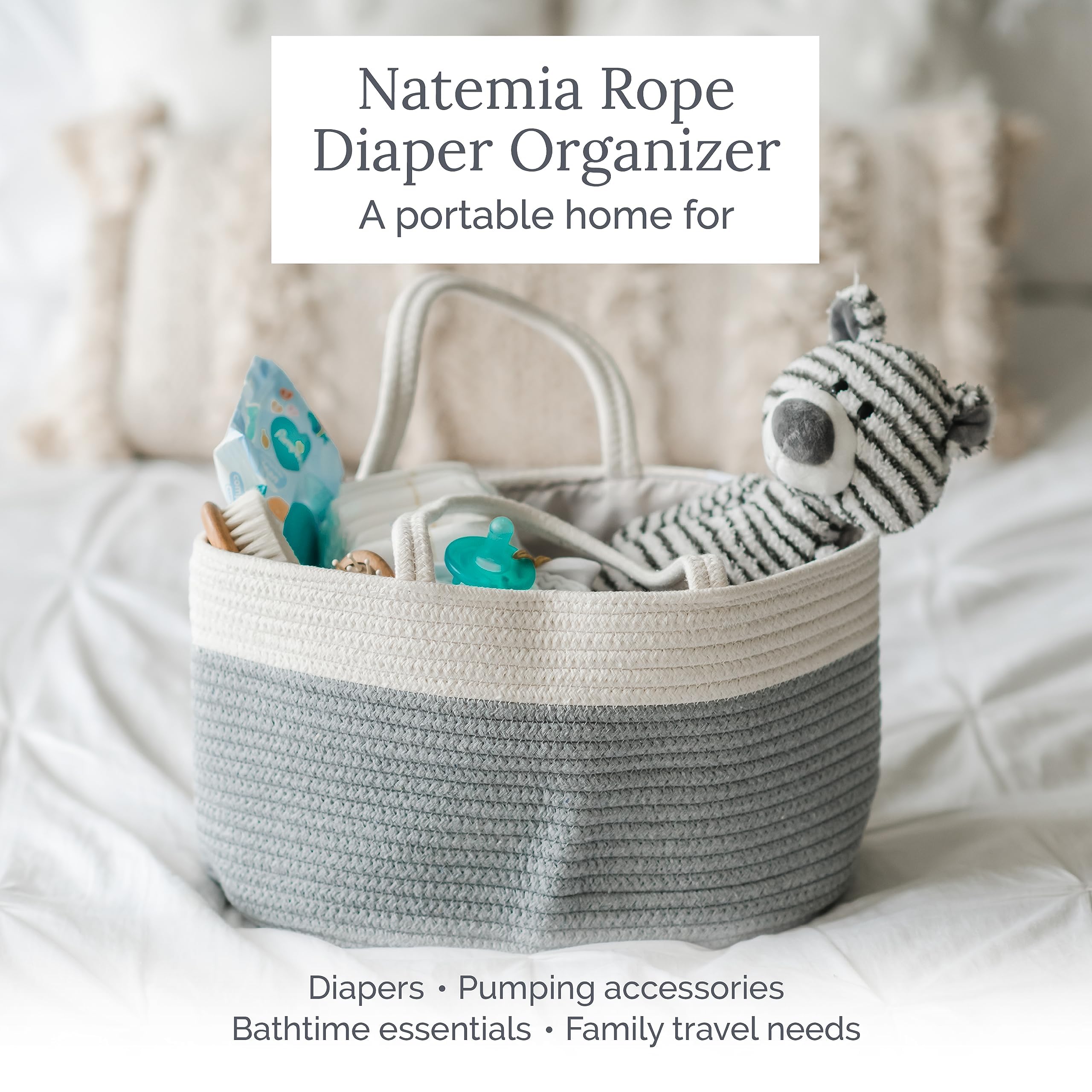 Natemia nappy caddy in neutral color beside changing table for tidy storage