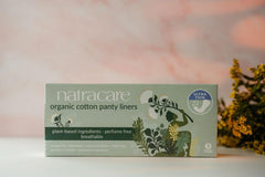Natracare Organic Cotton Ultra Thin Liner close-up texture shows soft cotton for sensitive skin.