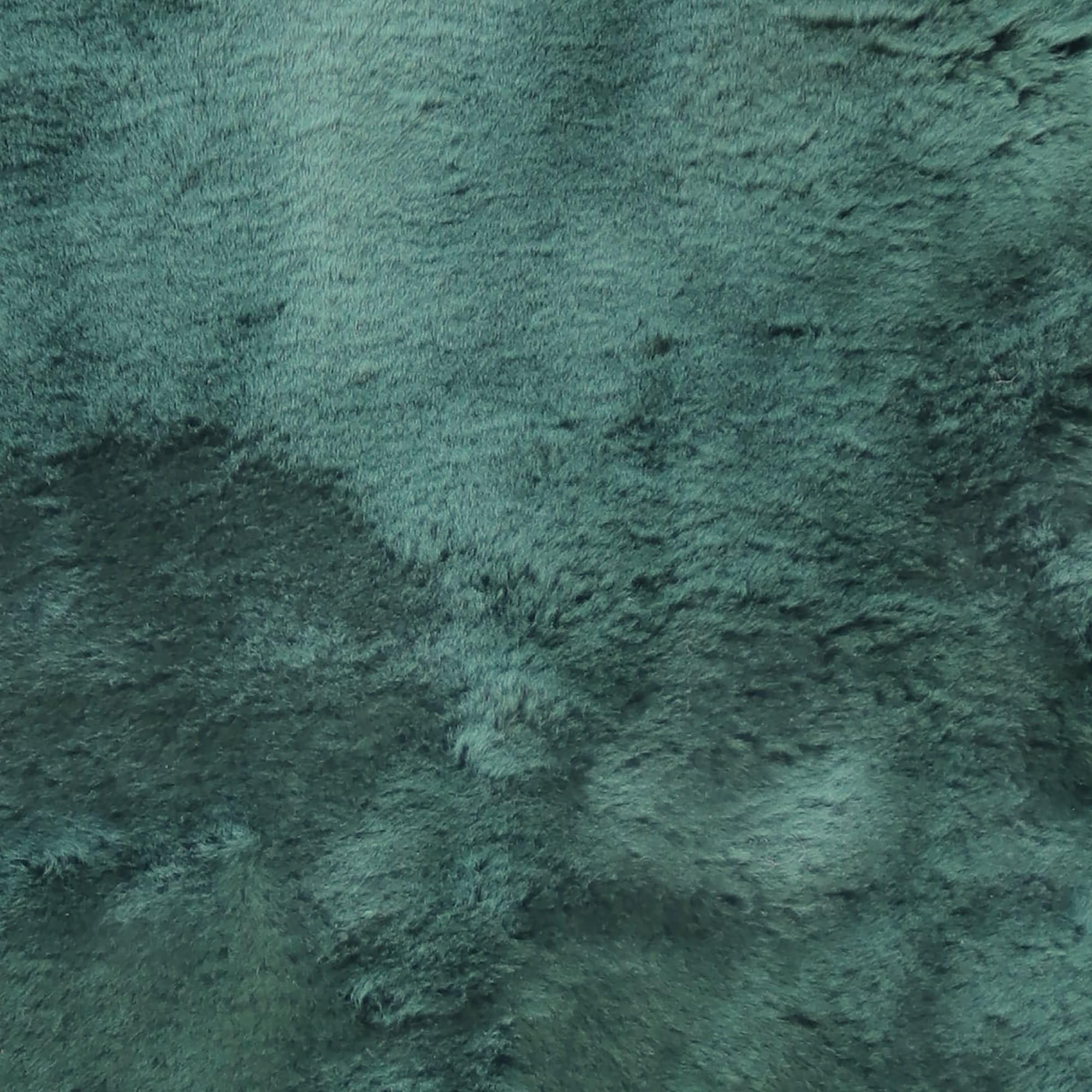 Natural Design Emerald sheepskin bed pad in use for breathable comfort and pressure relief