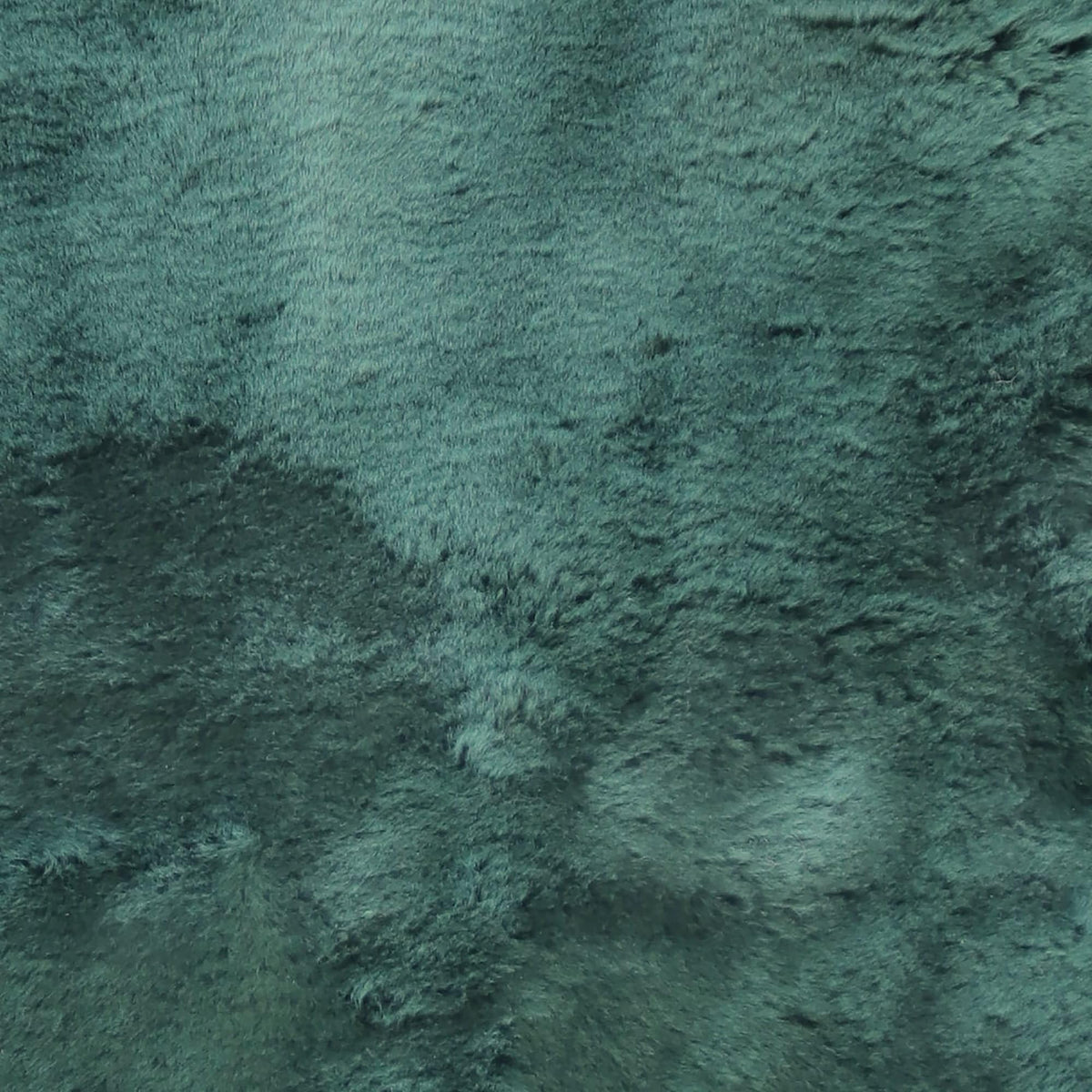 Natural Design Emerald sheepskin bed pad in use for breathable comfort and pressure relief