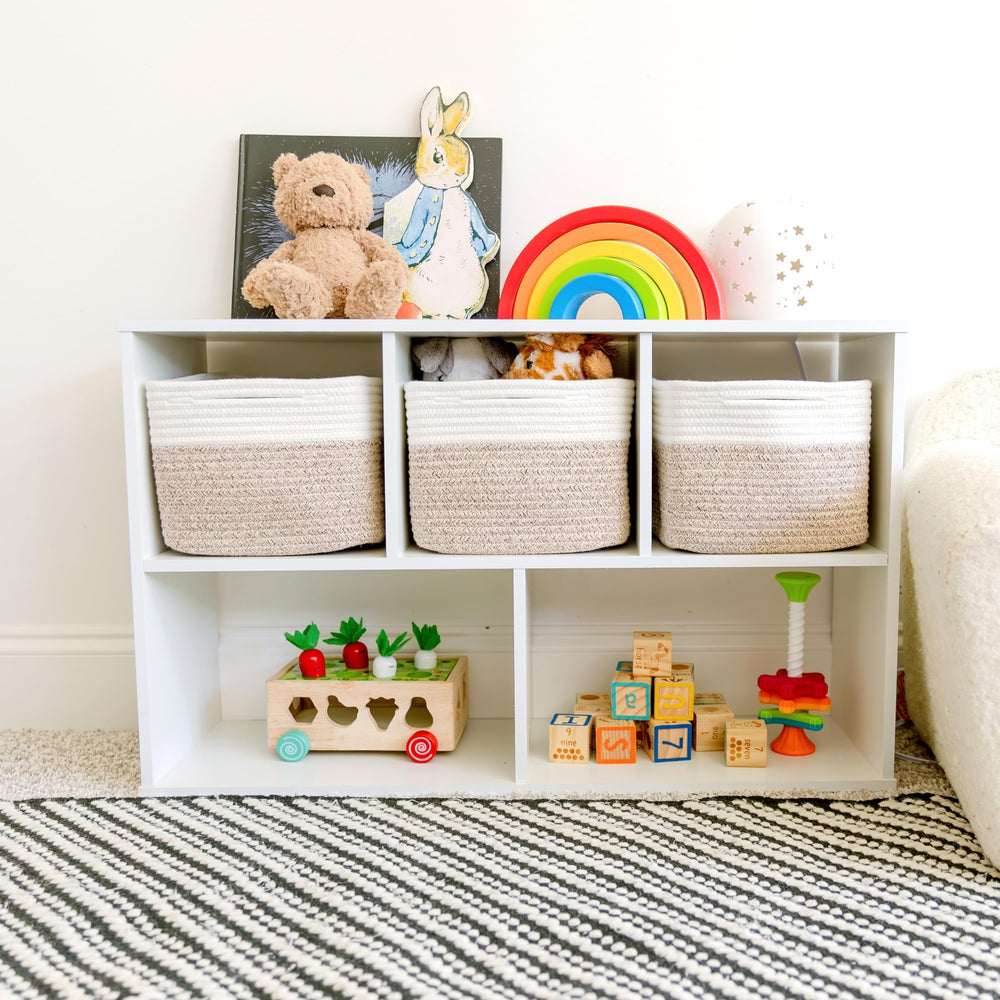 NaturalCozy 9-inch cube bin on living room shelf keeping toys organized