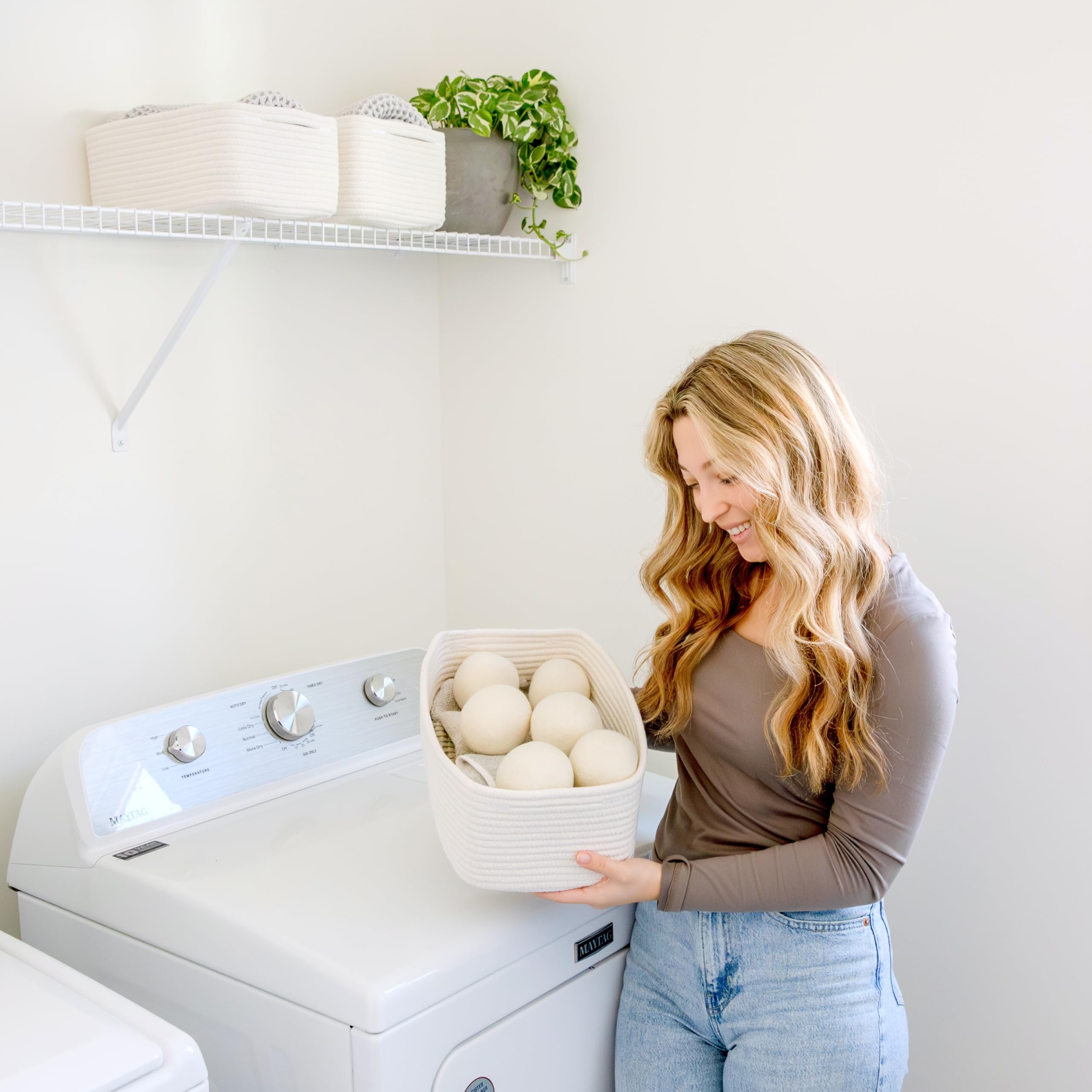 NaturalCozy basket in bathroom for towels and toiletries.