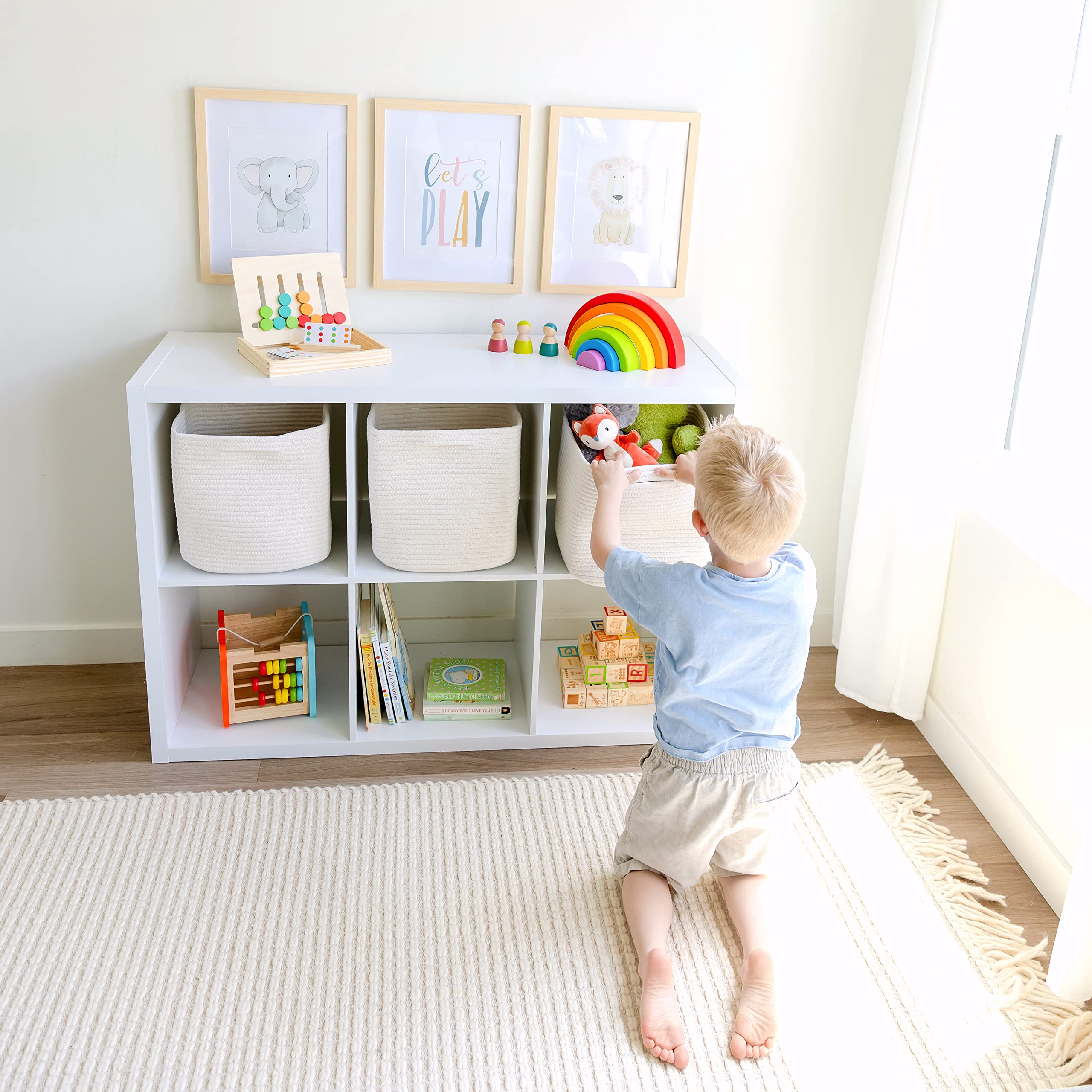 NaturalCozy square storage bins on a shelf offering roomy toy and blanket storage.