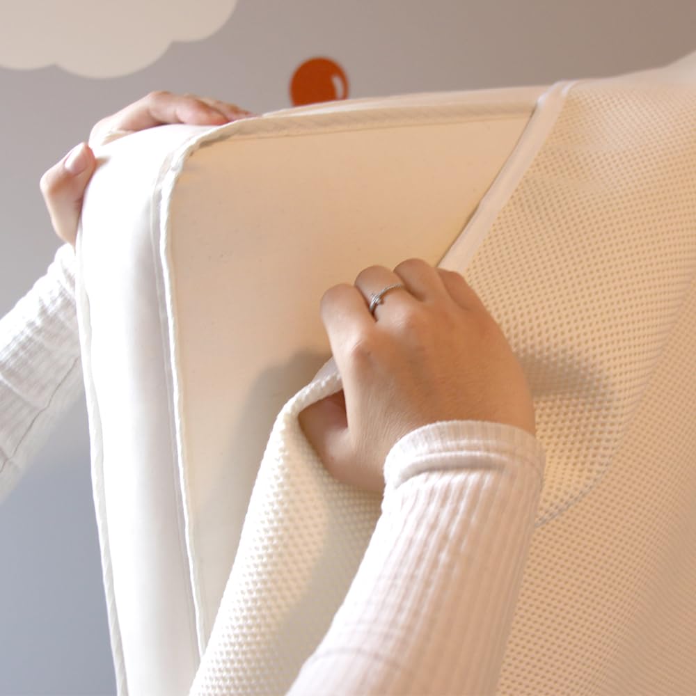 Naturepedic breathable surface promotes comfortable sleep for baby and toddler.