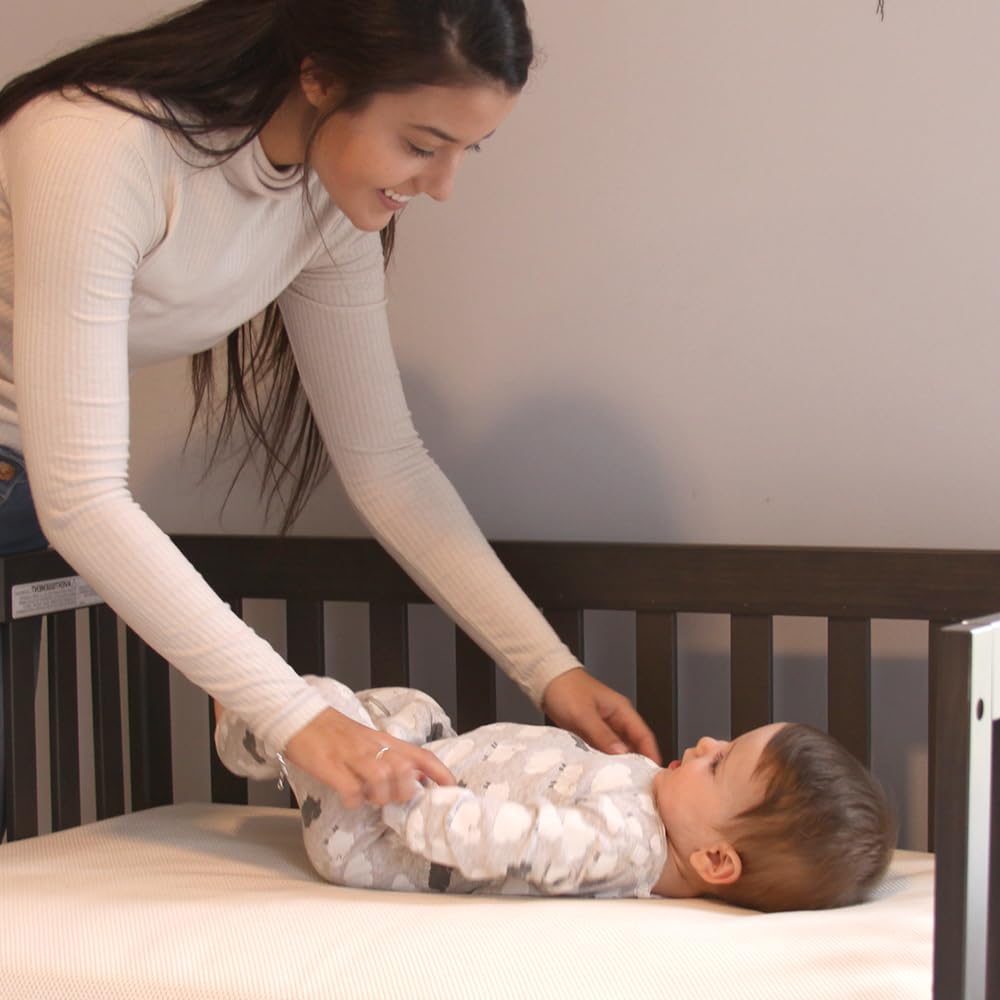 Naturepedic crib mattress 2-stage design supports infant to toddler transitions.