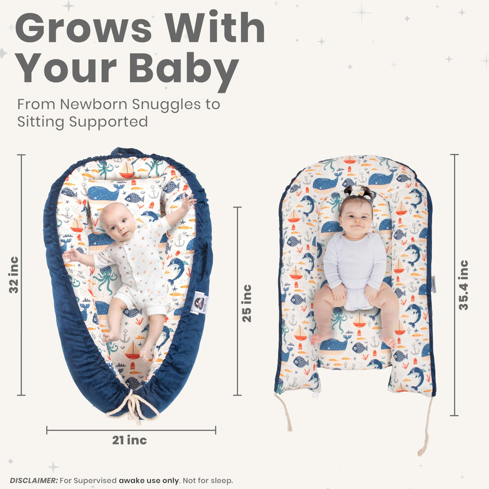 Nebulita newborn lounger blue doubles as a portable supervised floor lounge.