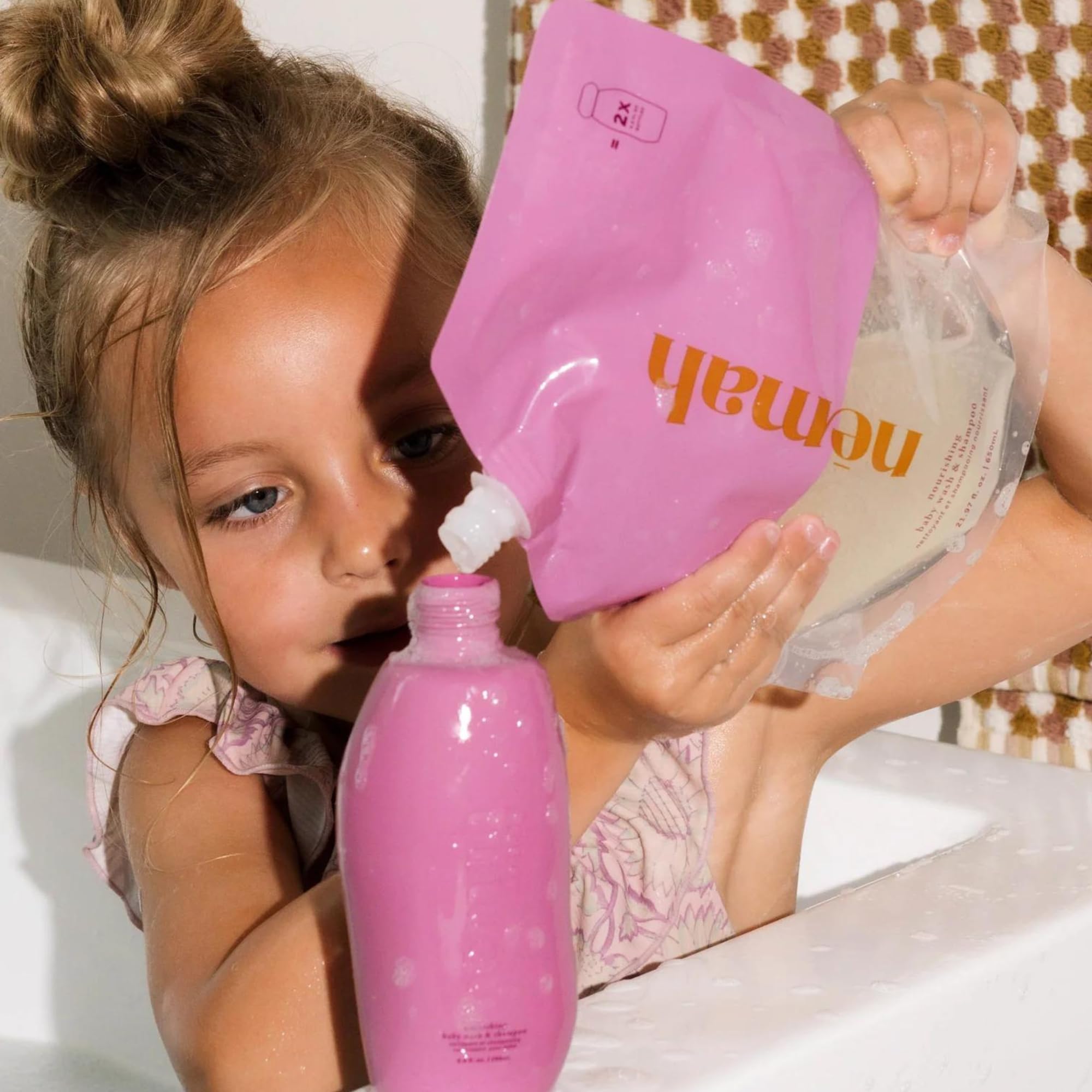 Nemah tear-free lather shown on baby hair and skin.