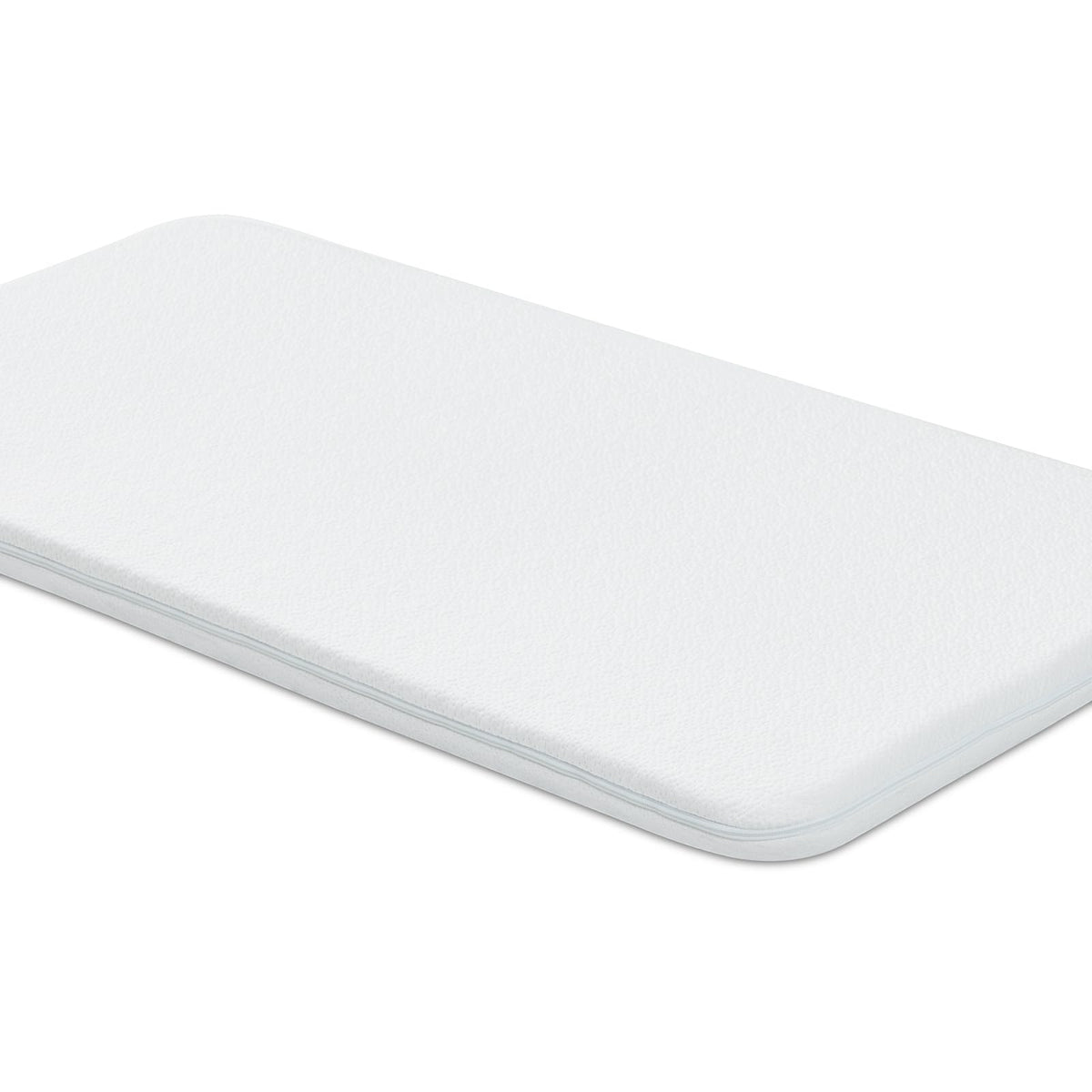 NeoBorn bassinet mattress pad foam close-up, dual-sided support for growing babies.