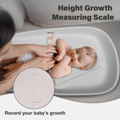 Nest Mello changing pad height scale demo shows growth tracking during diaper changes.
