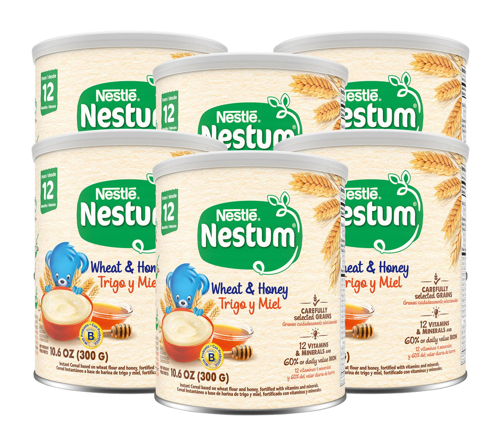 Nestum infant cereal canister with spoon highlighting iron and vitamins for growth